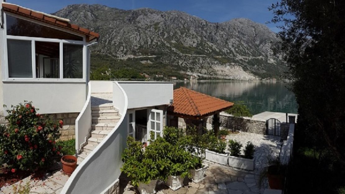 bay of kotor house with pier